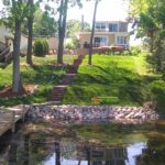 brick walkway from lake house to dock