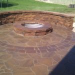 brick fireplace in backyard