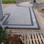 gray brick patio under construction