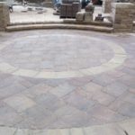 colored stone patio installation project under construction